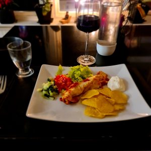 Enchiladas under krämigt täcke